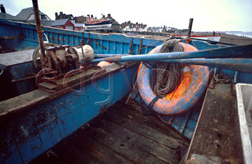 Comp image : boat0114 : Lifebelt and oars in a blue painted fishing boat on the shore at Aldeburgh, Suffolk, England