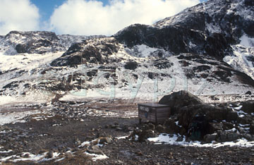 Comp image : ld02106 : The mountain rescue box at Sty Head in the Lake District. Looking east. Light snow and a hint of sun.