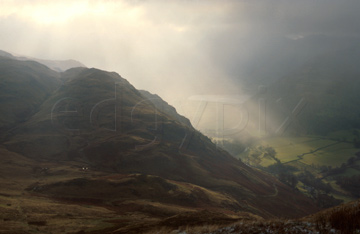 Comp image : ld02301 : Sun breaking through heavy cloud over Brothers Water and dark Lake District fells near Patterdale