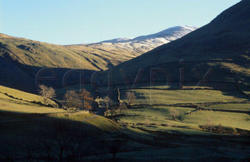 Comp image : ld02407 : Thornthwaite Crag from Hartsop, in the English Lake District. Snow on the Crag, and strong winter sun.