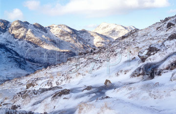 Comp image : ld02607 : Snow-covered Crinkle Crags, Great Langdale, in the English Lake District, under a blue sky and winter sun, seen from the base of Great Knot