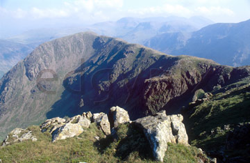 Comp image : ld03909 : Looking along the ridge from High Stile to High Crag, over Buttermere in the English lake District, with summer afternoon sun on the foreground rocks