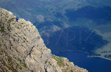 Comp image : ld03910 : Climbers on the eastern face of High Stile, in the English Lake District, with Buttermere in the background below