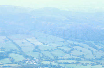 Comp image : ld05222 : A delicate view through mist towards the patchwork fields around Loweswater, from Grasmoor, over Crummock Water in the English Lake District