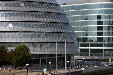 Comp image : lond010022 : People enjoy the sun at City Hall in the 'More London' development between London Bridge and Tower Bridge on the south bank of the River Thames, London, England