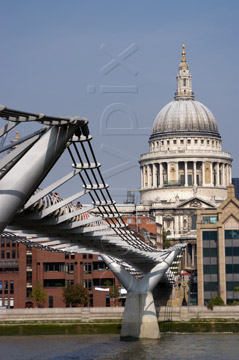 Comp image : lond010085 : Suspension cables of the Millennium footbridge across the River Thames in London, England, with St. Pauls Cathedral in sunshine in the background