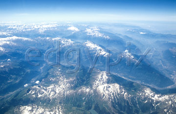 Comp image : sky0110 : Blue aerial view of the Swiss Alps, with patches of snow
