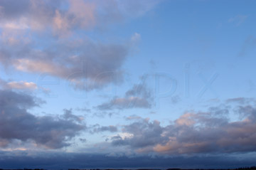 Comp image : sky020844 : Pink tinted wispy clouds spread out against a blue evening sky