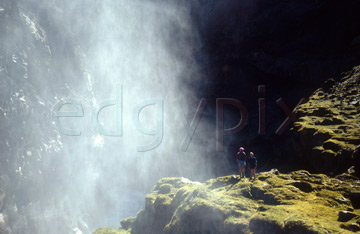Comp image : torf0312 : Spray from a waterfall over the Markarfljót Gorge [Markarfljot Gorge], Iceland. Two figures stand just out of reach.