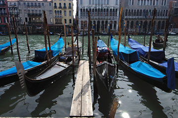 Comp image : ven021310 : Gondolas moored in strong sunshine on the Grand Canal [Canal Grande] in Venice, Italy