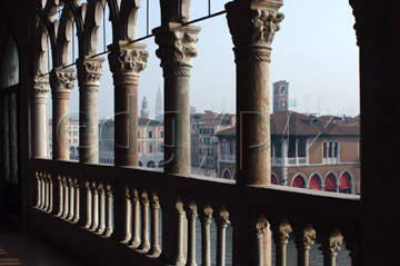 Comp image : ven021549 : Silhouette of stone pillars and balustrade of the Ca' d'Oro (built between 1421 and 1440) in Venice, Italy, the buildings of the fish market just visible on the other side of the Grand Canal 