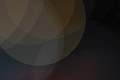 Subdued abstract photo with overlapping translucent circles on a dark background Subdued abstract photo with overlapping translucent circles on a dark background