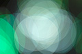 Bright abstract photo with overlapping white and green translucent circles Bright abstract photo with overlapping white and green translucent circles