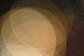 abstract photo with overlapping orange and yellow translucent circles over a dark background abstract photo with overlapping orange and yellow translucent circles over a dark background