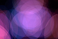 Abstract photo with overlapping purple and blue translucent circles on a dark background Abstract photo with overlapping purple and blue translucent circles on a dark background