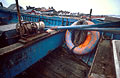 Lifebelt and oars in a blue painted fishing boat on the shore at Aldeburgh, Suffolk, England Lifebelt and oars in a blue painted fishing boat on the shore at Aldeburgh, Suffolk, England