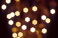 Golden out-of-focus highlights against a dark background Golden out-of-focus highlights against a dark background