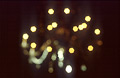 Small out-of-focus highlights against a dark background Small out-of-focus highlights against a dark background