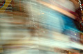 Strongly blurred image of a moving fairground carousel Strongly blurred image of a moving fairground carousel