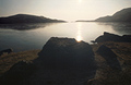 Bright winter sun over Stickle Tarn, Langdale, in the English Lake District