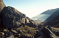 Looking into the sun from Swirl How, in the English Lake District, with cloud in the Greenburn valley below