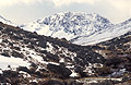 Approaching Sty Head from Seathwaite, in the Lake District, with Green Gable under snow in the distance