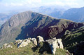 Looking along the ridge from High Stile to High Crag, over Buttermere in the English lake District, with summer afternoon sun on the foreground rocks