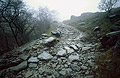 A damp, heavy mist hangs over the stones of the track up to the disused mine in Greenburn, below Wetherlam in the English Lake District