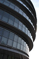 Dramatic shapes of City Hall, London, against the sky. Building designed by Foster and Partners, and home to the Greater London Authority.