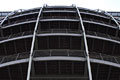 Looking up at a dramatic curved steel structure on a modern building in London, England