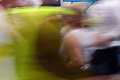 The blur of runners in the London Marathon, with part of a roadside advertisement in the background