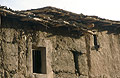 Part of a house in the High Atlas mountains in Morocco, showing the mud-brick walls and simple roof 