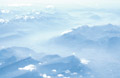 Misty light blue aerial view of the Swiss Alps Misty light blue aerial view of the Swiss Alps