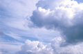 Big white cumulus and stratocumulus clouds in a sunny blue sky Big white cumulus and stratocumulus clouds in a sunny blue sky