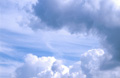 Cumulus clouds in a sunny blue sky