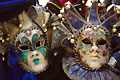 Two extravagantly decorated Carnivale masks on sale in Venice, Italy
